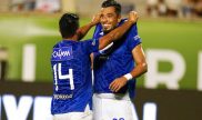 David Silva y Fernando Uribe celebran un gol. Cuotas y pronósticos Millonarios vs América de Cali.